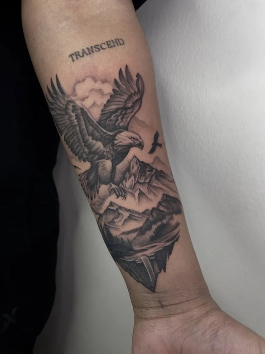 Big Black and Grey Eagle with Mountains and Clouds Tattoo on Men Arm by @theinklane