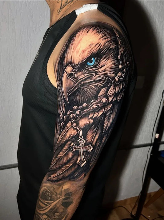 Big Black and Grey Eagle with Rosary and Cross Tattoo on Men Arm by @thtattoo.artist