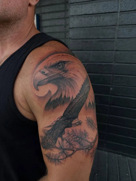 Big Black and Grey Eagle with Tree Tattoo on Men Shoulder by @third_moon_tattoos
