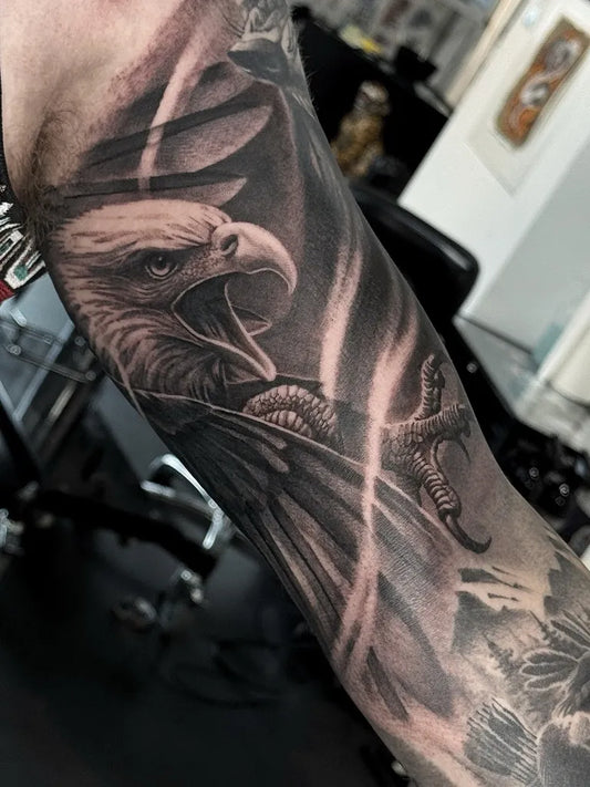 Big Black and Grey Eagle with Wings Tattoo on Men Arm by @master_of_none_tattoo