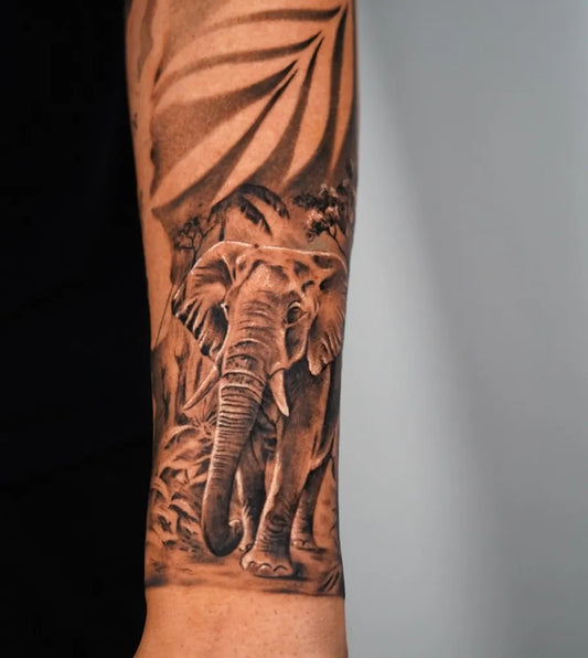 Big Black and Grey Elephant Palm Tree Tattoo on Men Arm by @salitattoo