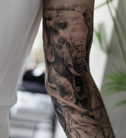 Big Black and Grey Elephant Tattoo on Men Arm by @chris_roelofs