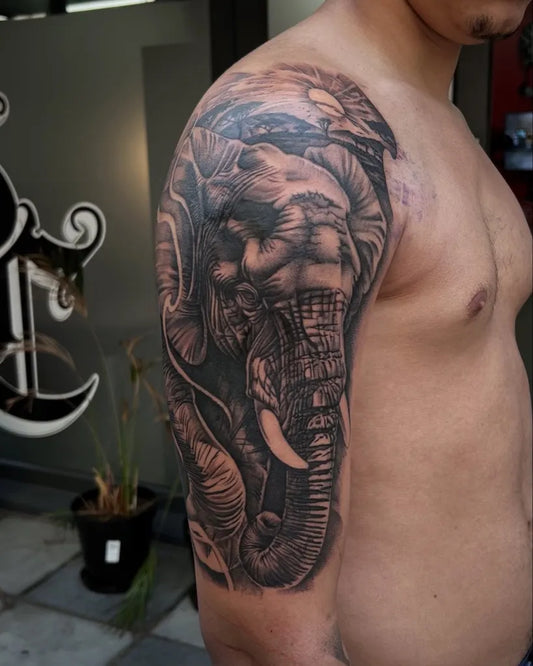 Big Black and Grey Elephant Tattoo on Men Shoulder by @its_xhrispy
