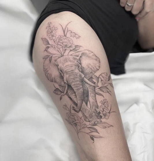 Big Black and Grey Elephant and Lilac Flowers Tattoo on Women Thigh by @tattoosbysarahh