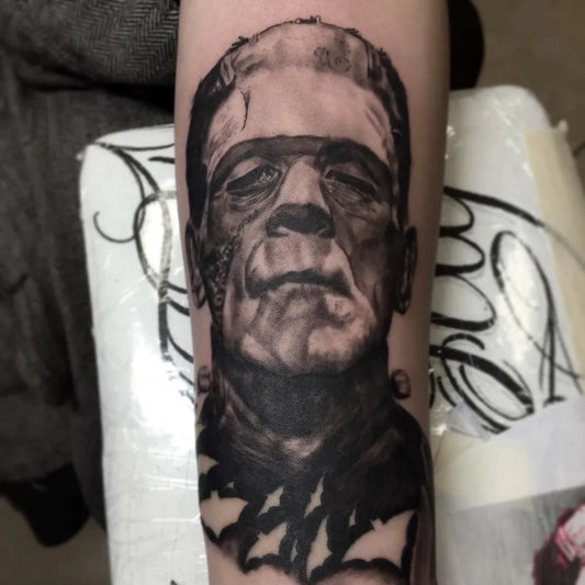 Big Black and Grey Frankenstein Monster Horror Tattoo on Men Arm by @jay_maloneart