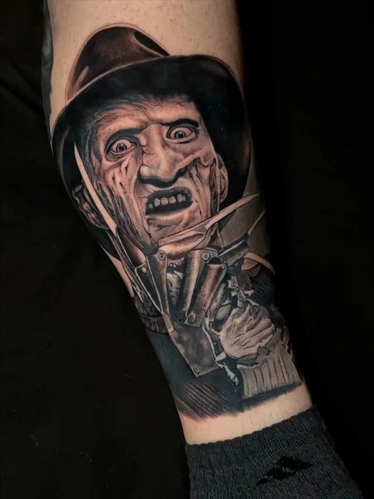 Big Black and Grey Freddy Krueger Horror Tattoo on Men Arm by @rafaelfuentestattoos
