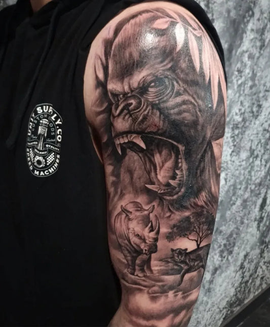 Big Black and Grey Gorilla Rhino Tree Tattoo on Men Arm by @phreshink