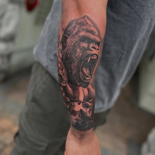 Big Black and Grey Gorilla Skull Waves Tattoo on Men Arm by @mistergreyz