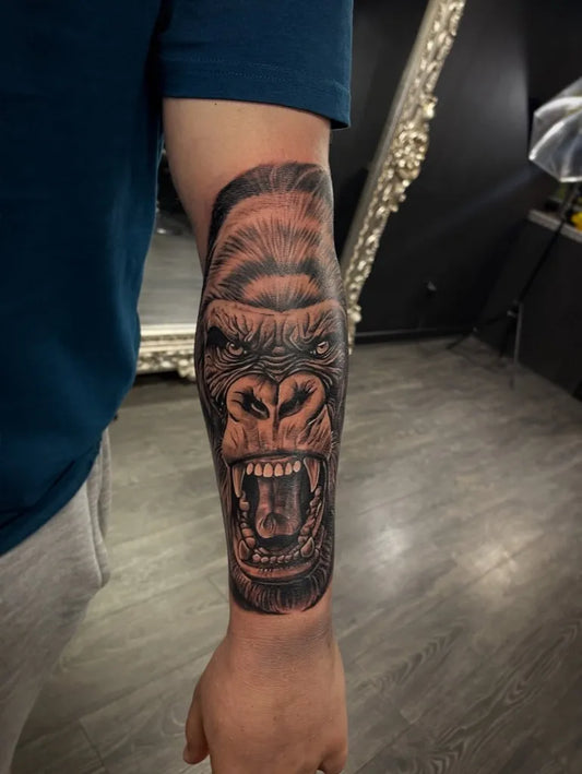 Big Black and Grey Gorilla Tattoo on Men Arm by @basement22tattoo