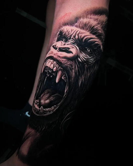 Big Black and Grey Gorilla Tattoo on Men Arm by @erikgitattooer_