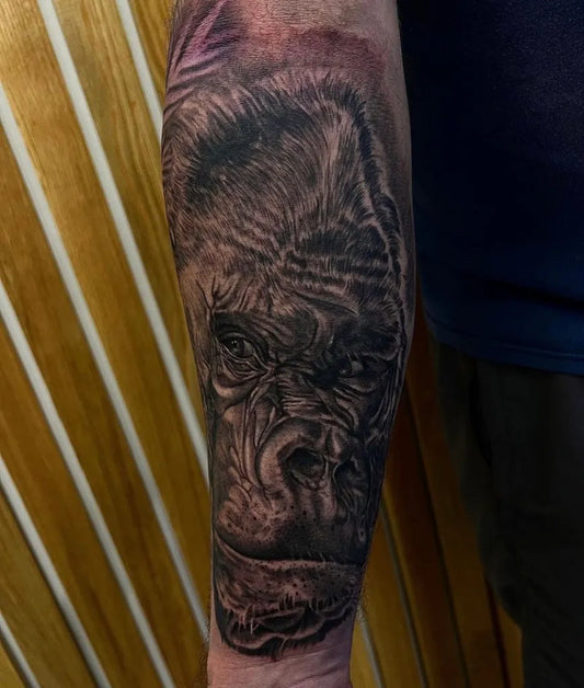 Big Black and Grey Gorilla Tattoo on Men Arm by @newimagetattoostudio