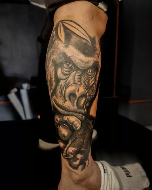 Big Black and Grey Gorilla Tattoo on Men Leg by @jatinripztattooofficial