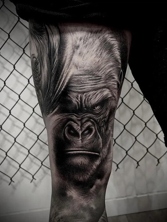 Big Black and Grey Gorilla Tattoo on Men Leg by @mandrzejaktattoo