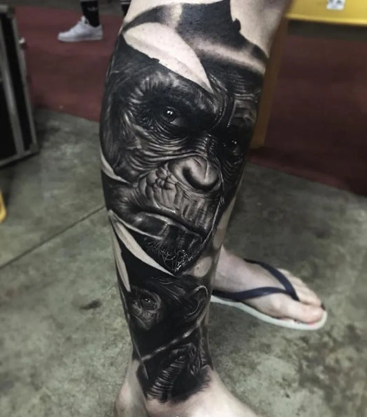 Big Black and Grey Gorilla Tattoo on Men Leg by @mementopublishing