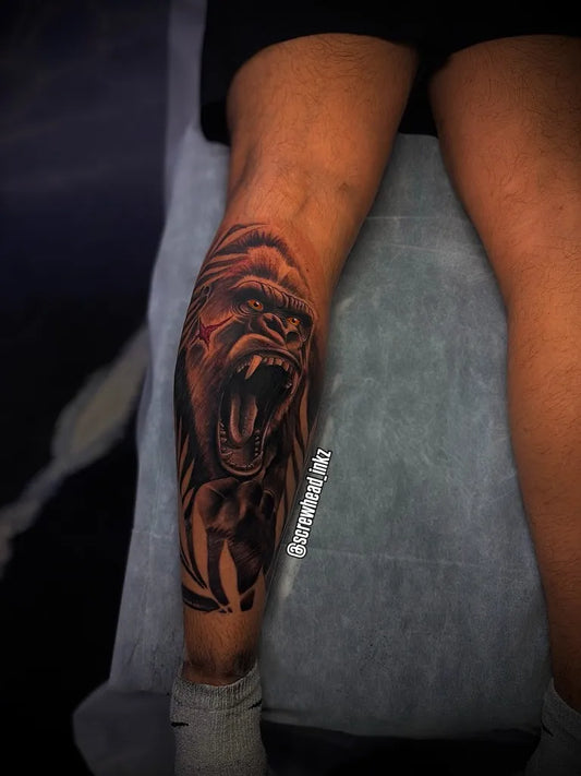 Big Black and Grey Gorilla Tattoo on Men Leg by @screwhead_inkz