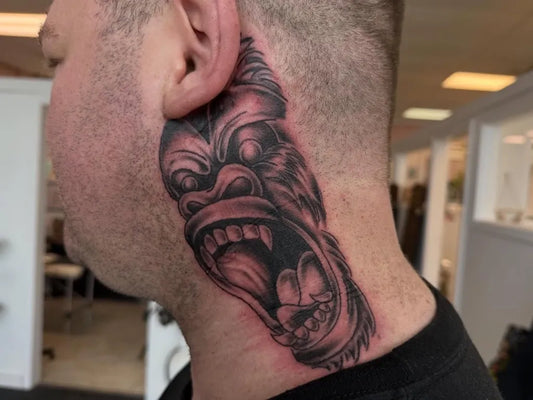 Big Black and Grey Gorilla Tattoo on Men Neck by @vic.tatts