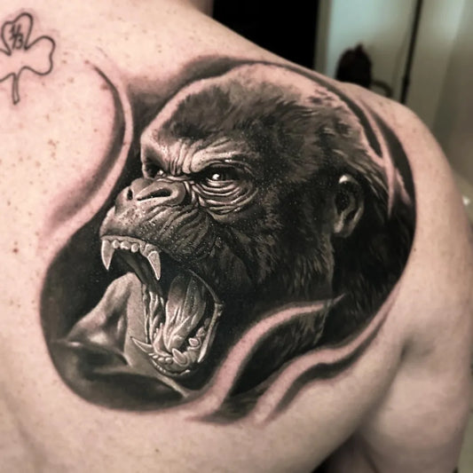 Big Black and Grey Gorilla Tattoo on Men Shoulder by @delmer_tattoo_shop