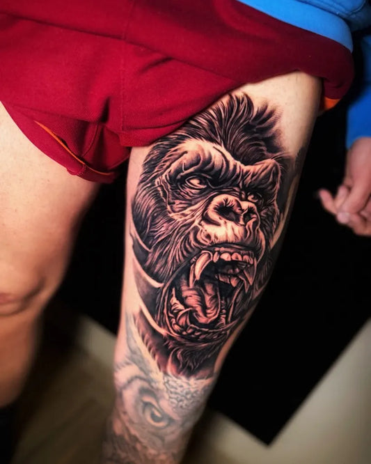 Big Black and Grey Gorilla Tattoo on Men Thigh by @bross_tattoo