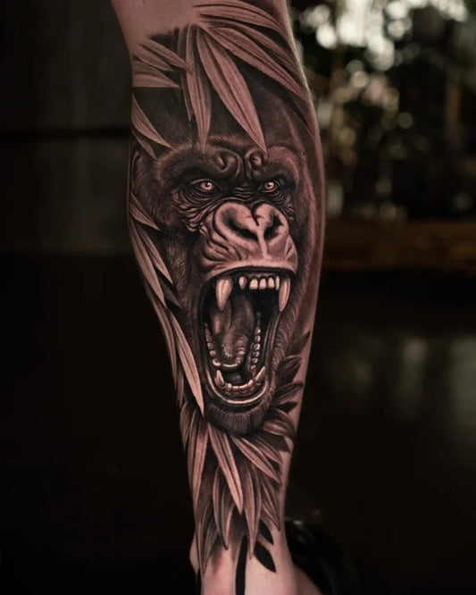 Big Black and Grey Gorilla with Bamboo Tattoo on Men Leg by @thelittlerabbitink