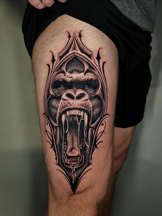 Big Black and Grey Gothic Frame Gorilla Tattoo on Men Thigh by @pristineink
