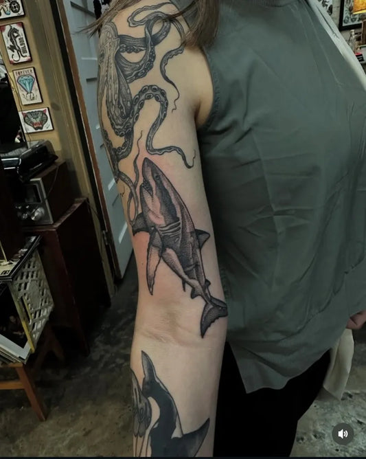 Big Black and Grey Great White Shark and Octopus on Women Arm Tattoo by @ironcladtattoogallery