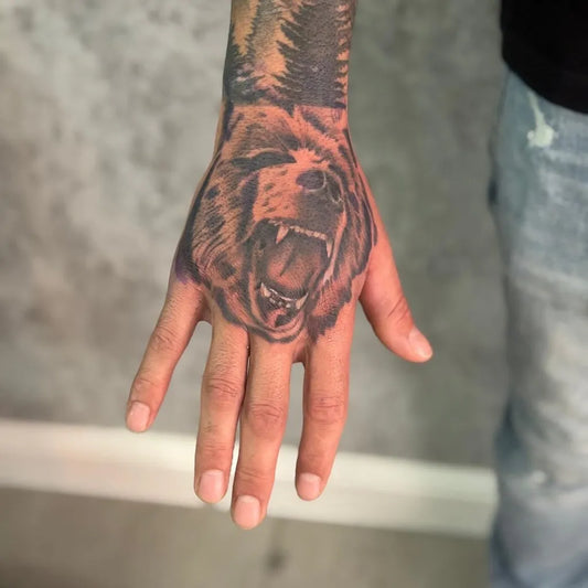 Big Black and Grey Grizzly Bear with Trees on Men Forearm Tattoo by @wasem.tattoo