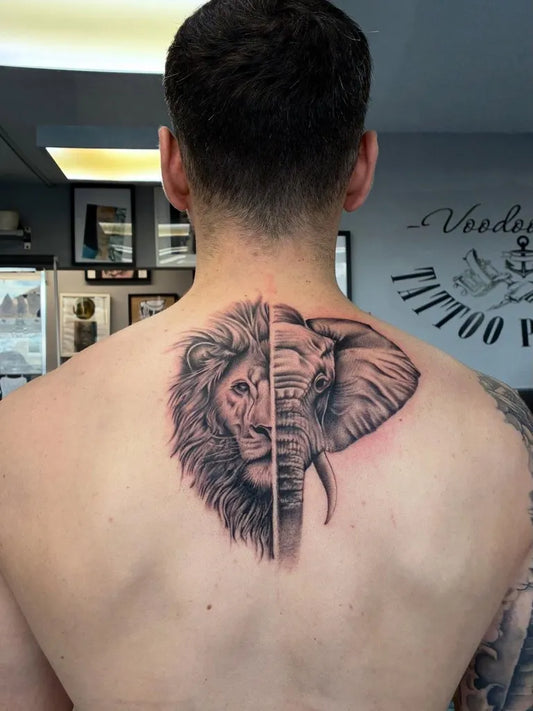 Big Black and Grey Half Lion Half Elephant on Men Back Tattoo by @badazz.tattoo