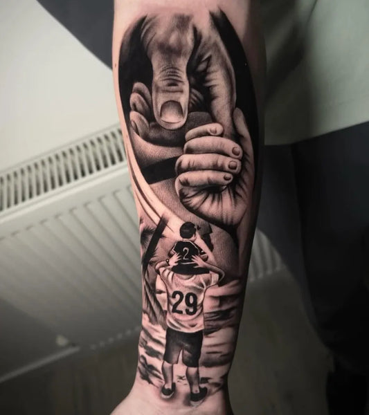 Big Black and Grey Hands Holding Child Family Tattoo on Men Arm by @allsacredtattooparlour