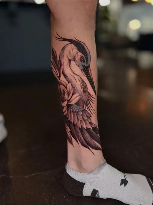 Big Black and Grey Heron and Rose Tattoo on Women Leg by @melissanicholetattoos