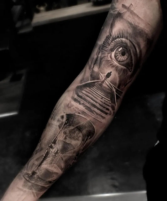 Big Black and Grey Hourglass Eye Stairs Tattoo on Men Arm by @glenpreece
