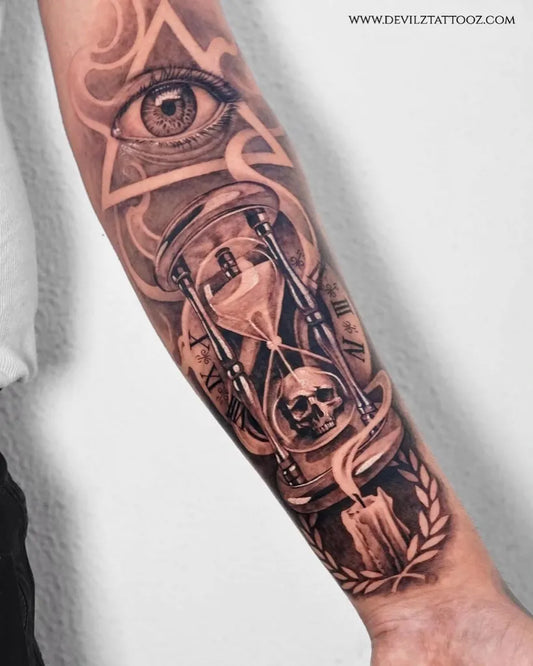 Big Black and Grey Hourglass Skull Laurel Tattoo on Men Arm by @devilztattooz