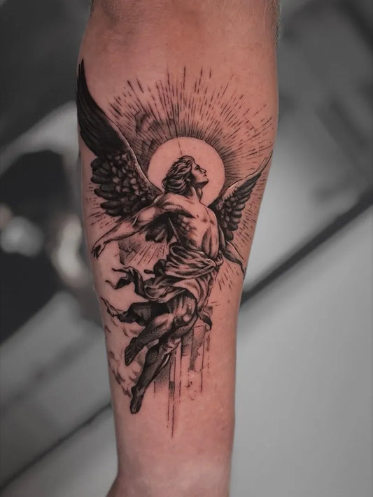Big Black and Grey Icarus Angel on Men Arm Tattoo by @mitchelkelftattoo