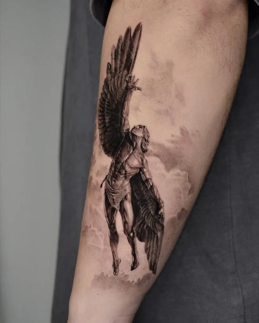 Big Black and Grey Icarus with Angel Wings on Men Arm Tattoo by @hando_tattoo