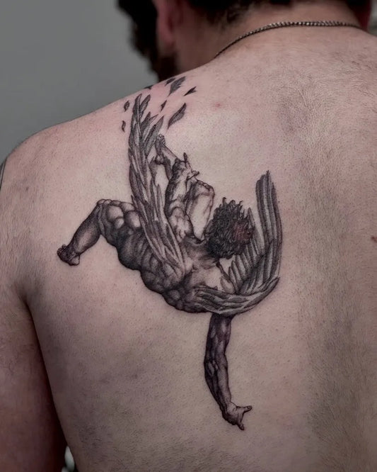Big Black and Grey Icarus with Falling Wings on Men Back Tattoo by @lvi.ink