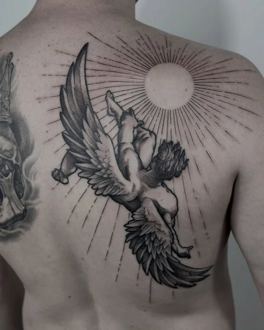 Big Black and Grey Icarus with Sun and Wings on Men Back Tattoo by @marcusrotten