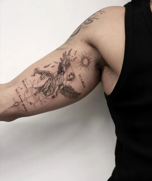 Big Black and Grey Icarus with Wings and Sun on Men Arm Tattoo by @linesbyli_tattoo