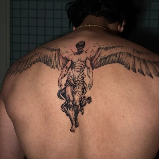 Big Black and Grey Icarus with Wings on Men Back Tattoo by @lilg.ig