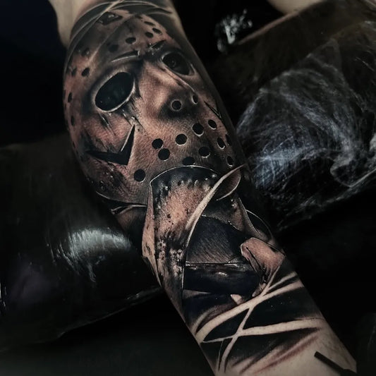 Big Black and Grey Jason Voorhees Mask Horror Tattoo on Men Arm by @no.one.tattoo_