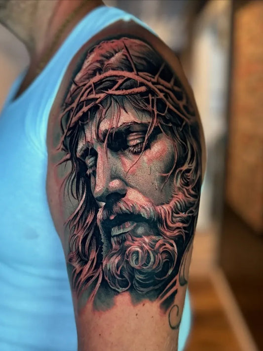 Big Black and Grey Jesus Christ Portrait Tattoo on Men Shoulder by @felleti_1nk