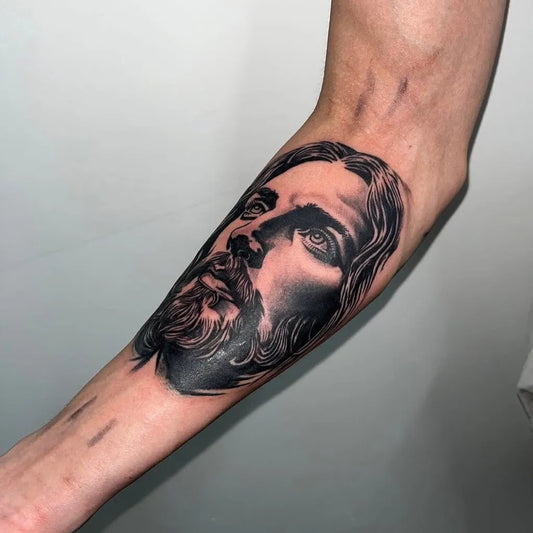 Big Black and Grey Jesus Portrait Tattoo on Men Arm by @deadly_e_tattoos