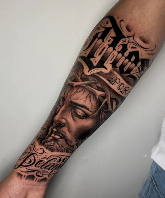 Big Black and Grey Jesus Portrait with Banner and Crown of Thorns Tattoo on Men Arm by @_aldaa.thm._