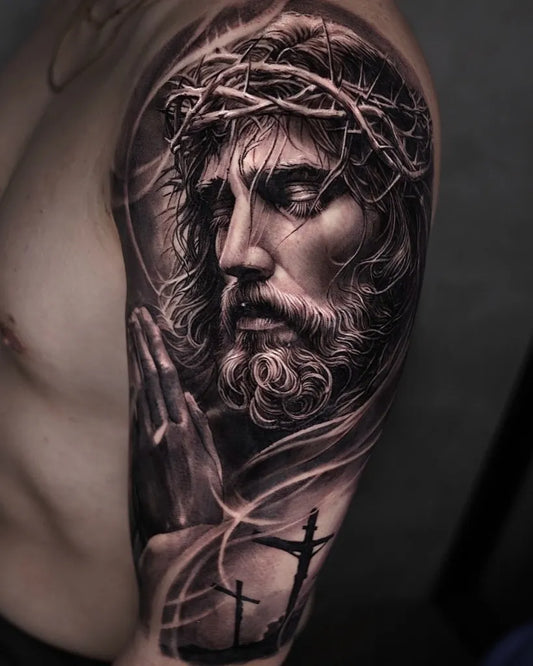 Big Black and Grey Jesus Praying with Crosses Tattoo on Men Arm by @cado__tt