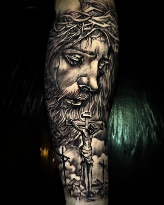 Big Black and Grey Jesus on Crucifix with Crown of Thorns Tattoo on Men Arm by @_tsites_