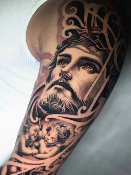 Big Black and Grey Jesus with Cherubs and Ornaments Tattoo on Men Arm by @chattov_