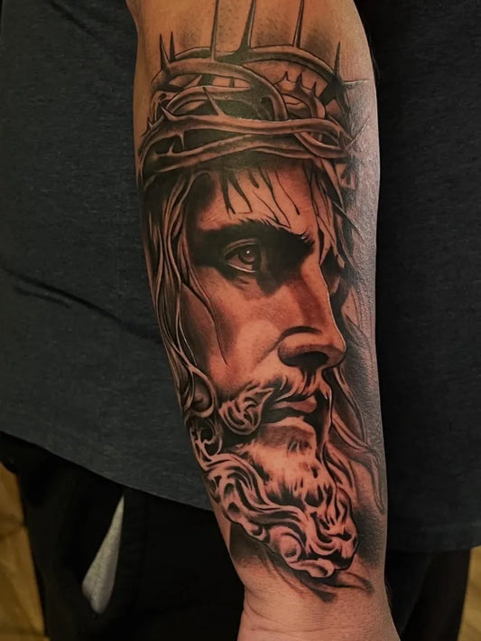 Big Black and Grey Jesus with Crown of Thorns Tattoo on Men Arm by @mattblanchardtattoos_
