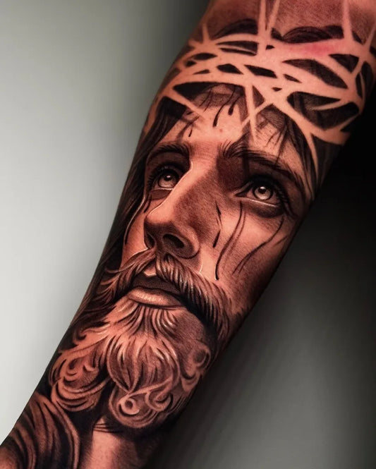Big Black and Grey Jesus with Crown of Thorns Tattoo on Men Arm by @rafaelbebbertattoo