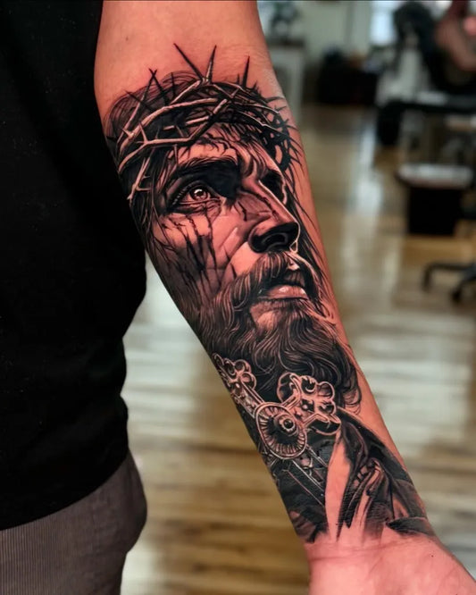 Big Black and Grey Jesus with Crown of Thorns Tattoo on Men Arm by @sirko_tattoo