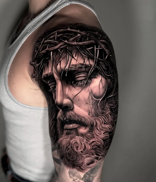 Big Black and Grey Jesus with Crown of Thorns Tattoo on Men Shoulder by @david_guzman_tattoo