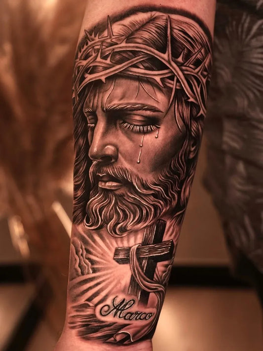 Big Black and Grey Jesus with Crown of Thorns and Cross Tattoo on Men Arm by @iinfinite.art