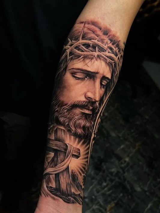 Big Black and Grey Jesus with Crown of Thorns and Cross Tattoo on Men Arm by @kaleo_tattoos